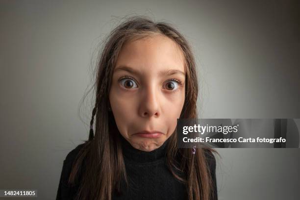 girl with an expression of disbelief - child shock studio stock pictures, royalty-free photos & images