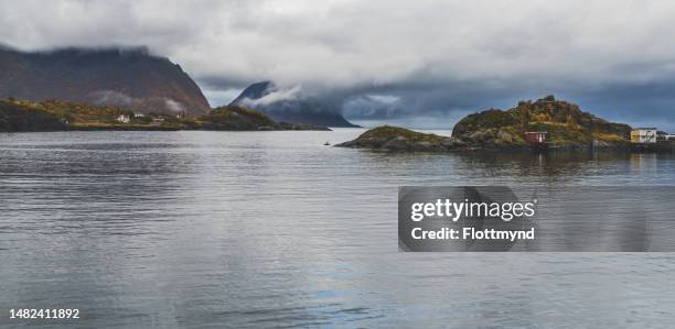 the beautiful views at hamn speak for themself, especially with all trees in autumn colors, troms og finnmark, norway.      man in canoe paddling along the coast - hamn stock pictures, royalty-free photos & images