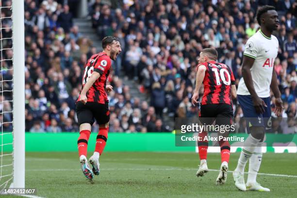 Matias Vina celebrates with Ryan Christie of AFC Bournemouth after scoring the team's first goal during the Premier League match between Tottenham...