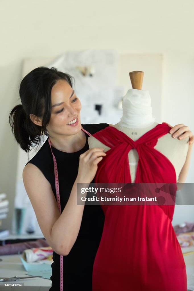 Female Fashion designer  in her studio