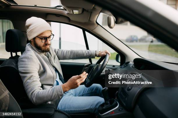 man using smartphone - mobile phone in hand driving stock pictures, royalty-free photos & images