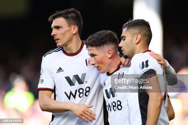 Harry Wilson of Fulham celebrates with teammates Andreas Pereira and Joao Palhinha after scoring the team's second goal during the Premier League...