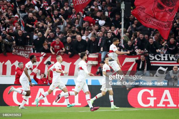 Josha Vagnoman of VfB Stuttgart celebrates with teammates after scoring the team's second goal during the Bundesliga match between VfB Stuttgart and...