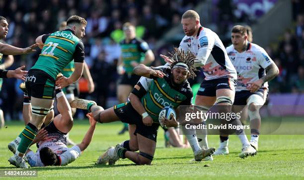 Lewis Ludlam of Northampton Saints is tackled during the Gallagher Premiership Rugby match between Northampton Saints and Saracens at Franklin's...