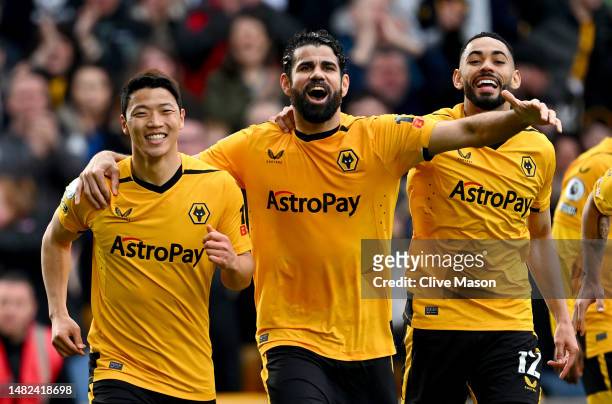 Hwang Hee-Chan of Wolverhampton Wanderers celebrates with teammates Diego Costa and Matheus Cunha after scoring the team's second goal during the...