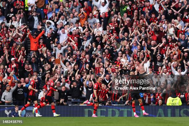 Dominic Solanke of AFC Bournemouth celebrates with the fans after scoring the team's second goal during the Premier League match between Tottenham...