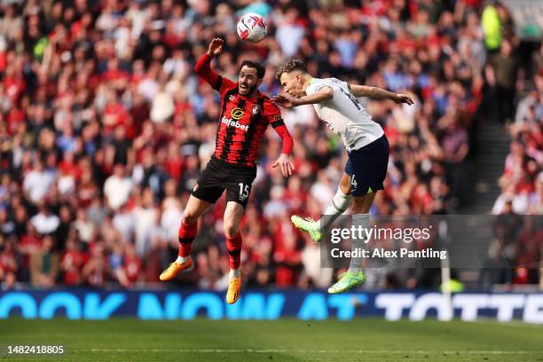 Adam Smith of AFC Bournemouth jumps for the ball with Ivan Perisic of Tottenham Hotspur during the Premier League match between Tottenham Hotspur and...