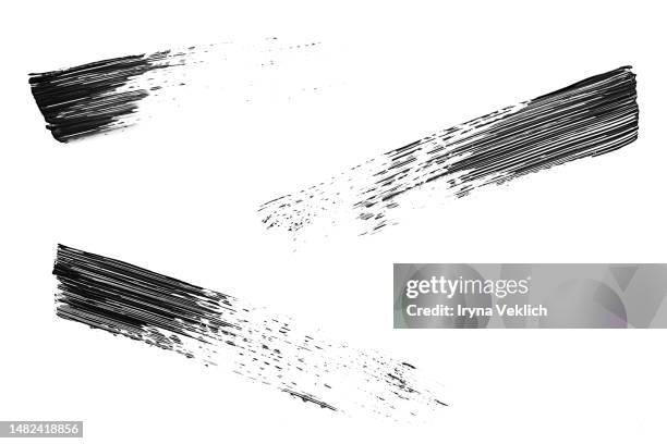 black smear mascara on white background, isolated. cosmetic make-up products for eyelashes. - mascara smear stock pictures, royalty-free photos & images