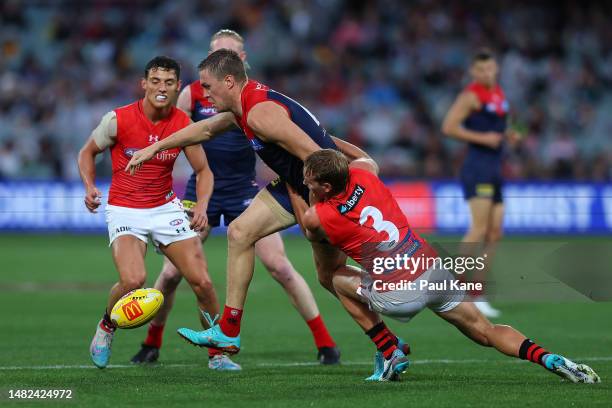 Darcy Parish of the Bombers tackles Tom McDonald of the Demons during the round five AFL match between Essendon Bombers and Melbourne Demons at...
