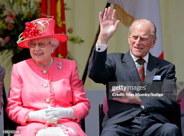 Queen Elizabeth II and Prince Philip, Duke of Edinburgh watch the Shropshire Diamond Jubilee Pageant during a visit to RAF Cosford as part of Queen...