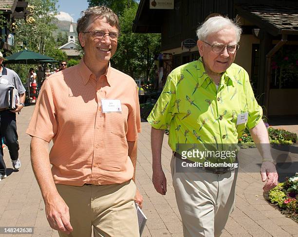 Bill Gates, chairman and founder of Microsoft Corp., left, and Warren Buffett, chairman of Berkshire Hathaway Inc., walk the grounds during the Allen...