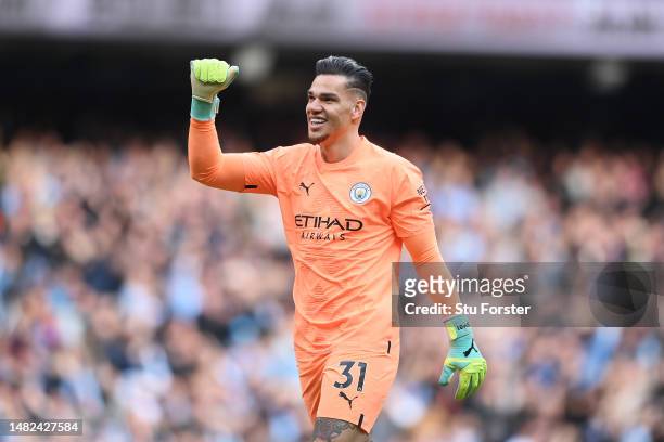 Ederson of Manchester City celebrates after their sides first goal during the Premier League match between Manchester City and Leicester City at...
