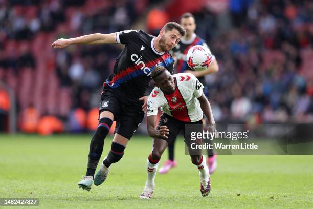 Joel Ward of Crystal Palace battles for possession with Moussa Djenepo of Southampton during the Premier League match between Southampton FC and...