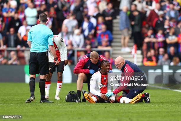 Armel Bella-Kotchap of Southampton receives medical treatment during the Premier League match between Southampton FC and Crystal Palace at St. Mary's...