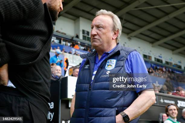 Russell Martin Head Coach of Swansea City greets Neil Warnock Head Coach of Huddersfield Town before the Sky Bet Championship match between Swansea...