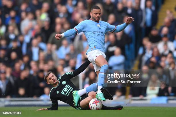 Kiernan Dewsbury-Hall of Leicester City tackles Kyle Walker of Manchester City during the Premier League match between Manchester City and Leicester...