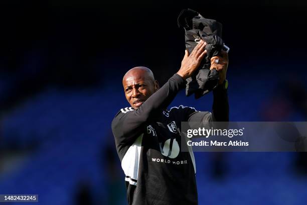 Luis Boa Morte, Assistant Manager of Fulham applauds the fans after the team's victory in the Premier League match between Everton FC and Fulham FC...