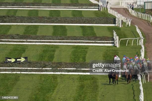 Runners by-pass a fence during The Randox Grand National Handicap Chase on Grand National Day during day three of the Grand National Festival at...