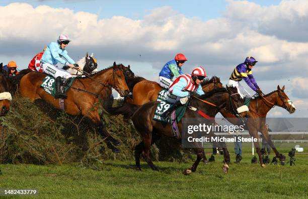 Corach Rambler ridden by Derek Fox jumps the Chair in the Randox Grand National Chase during day three of the Randox Grand National Festival at...