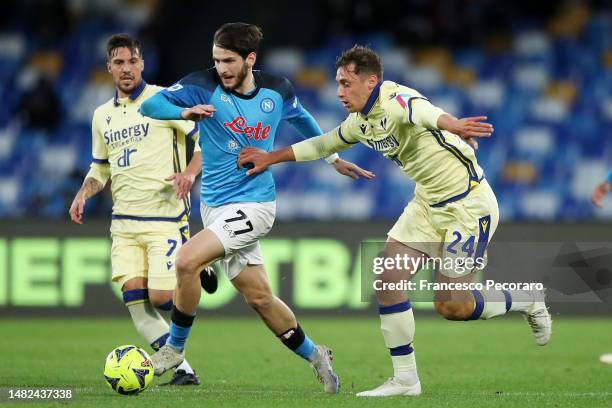 Khvicha Kvaratskhelia of SSC Napoli battles for possession with Filippo Terracciano of Hellas Verona during the Serie A match between SSC Napoli and...