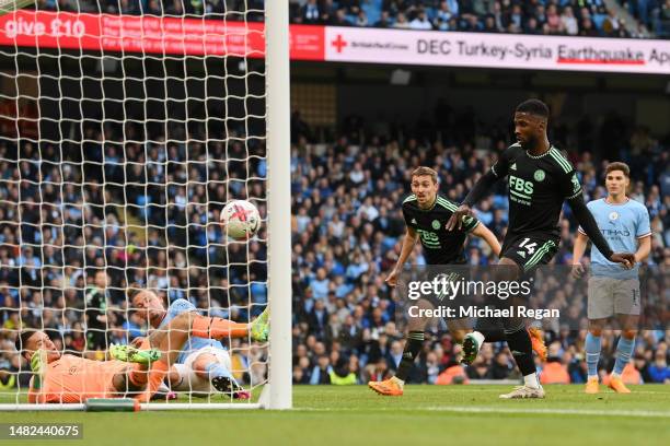 Kelechi Iheanacho of Leicester City scores the team's first goal during the Premier League match between Manchester City and Leicester City at Etihad...