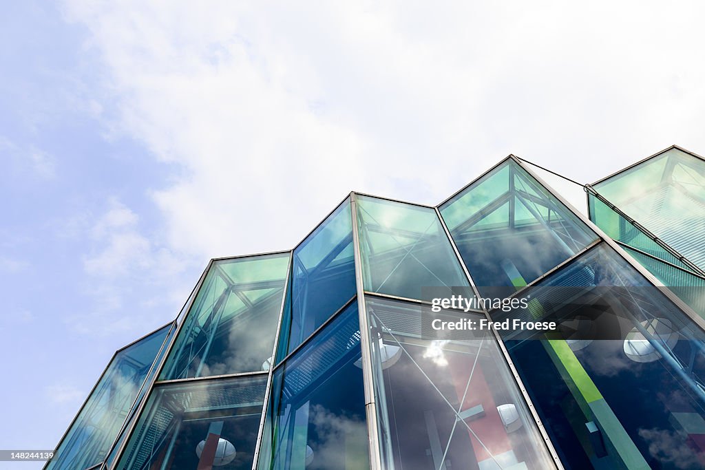 Reflections in part of a modern glass facade