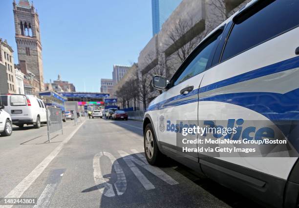 Cruiser and police officer on station blocking traffic in the area of the finish line on Boylston St on April 13, 2023 in , BOSTON, MA. .