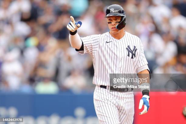 Aaron Judge of the New York Yankees reacts after hitting a double in the fifth inning against the Minnesota Twins at Yankee Stadium on April 15, 2023...