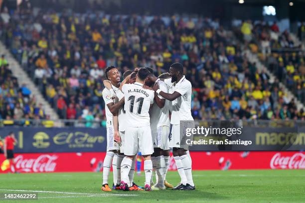 Nacho Fernandez of Real Madrid celebrates with teammates after scoring the team's first goal during the LaLiga Santander match between Cadiz CF and...