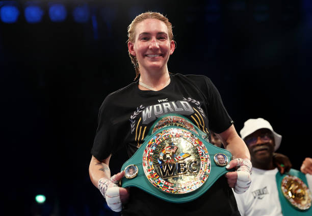 Mikaela Mayer celebrates victory while holding WBC Lightweight belt following the Lightweight fight between Mikaela Mayer and Lucy Wildheart at...