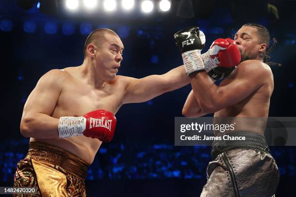 Zhilei Zhang punches Joe Joyce during the WBO Interim World Heavyweight Title fight between Joe Joyce and Zhilei Zhang at Copper Box Arena on April...