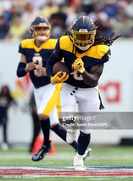 Running back Alex Collins of the Memphis Showboats carries the ball during the 1st quarter of the game against the Philadelphia Stars at Simmons Bank...