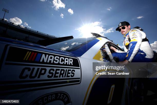 Chase Elliott, driver of the NAPA Auto Parts Chevrolet, enters his car during qualifying for the NASCAR Cup Series NOCO 400 at Martinsville Speedway...