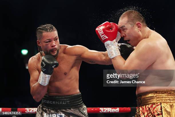 Joe Joyce punches Zhilei Zhang during the WBO Interim World Heavyweight Title fight between Joe Joyce and Zhilei Zhang at Copper Box Arena on April...