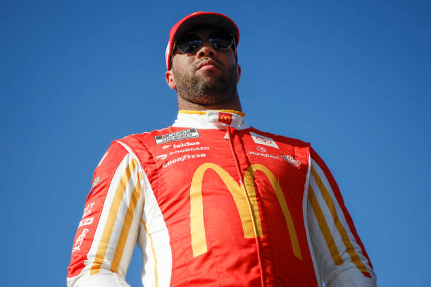 Bubba Wallace, driver of the McDonald's Toyota, waits on the grid during qualifying for the NASCAR Cup Series NOCO 400 at Martinsville Speedway on...