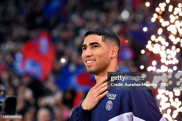 Achraf Hakimi of Paris Saint-Germain arrives on the pitch for the Ligue 1 match between Paris Saint-Germain and RC Lens at Parc des Princes on April...