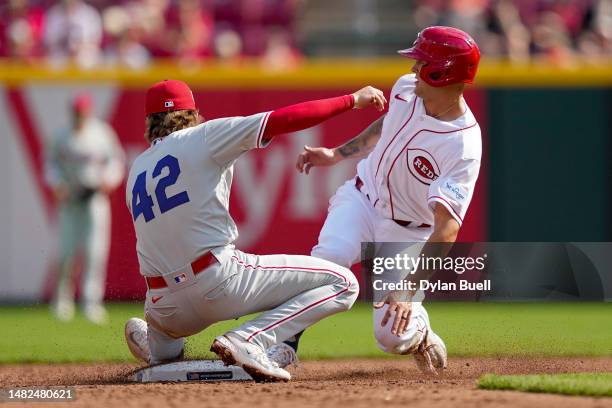 Nick Senzel of the Cincinnati Reds steals second base past Bryson Stott of the Philadelphia Phillies in the second inning of the game at Great...