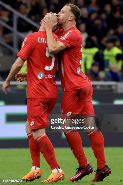Luca Caldirola of AC Monza celebrates with Carlos Augusto after scoring the his team's first goal during the Serie A match between FC Internazionale...