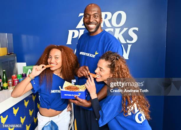 Taya Salley, John Salley and Natasha Duffy attend the Mother Plucker grand opening with TiNDLE at Mother Plucker on April 15, 2023 in Los Angeles,...