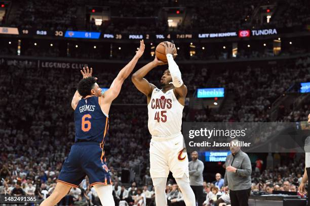 Donovan Mitchell of the Cleveland Cavaliers shoots over Quentin Grimes of the New York Knicks during the third quarter of Game One of the Eastern...