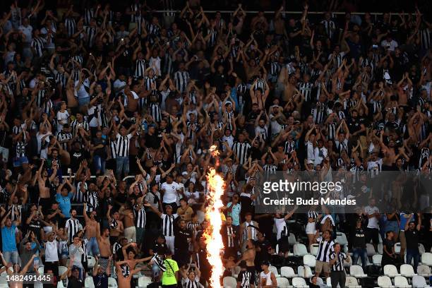 Fans of Botafogo cheer during a match between Botafogo and São Paulo as part of Brasileirao 2023 at Estadio Olímpico Nilton Santos on April 15, 2023...