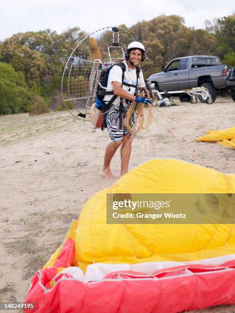 hispanic man paragliding - motor paraglider stock pictures, royalty-free photos & images