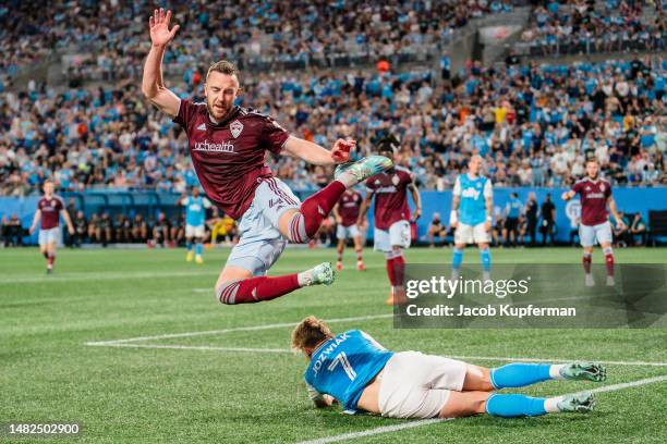 Danny Wilson of Colorado Rapids jumps over Kamil Jóźwiak of Charlotte FC in the first half during their game at Bank of America Stadium on April 15,...
