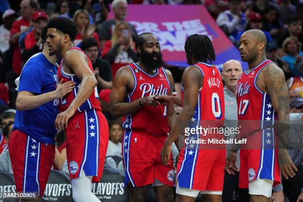 Georges Niang, James Harden, Tobias Harris, P.J. Tucker, and Tyrese Maxey of the Philadelphia 76ers congratulate one another against the Brooklyn...
