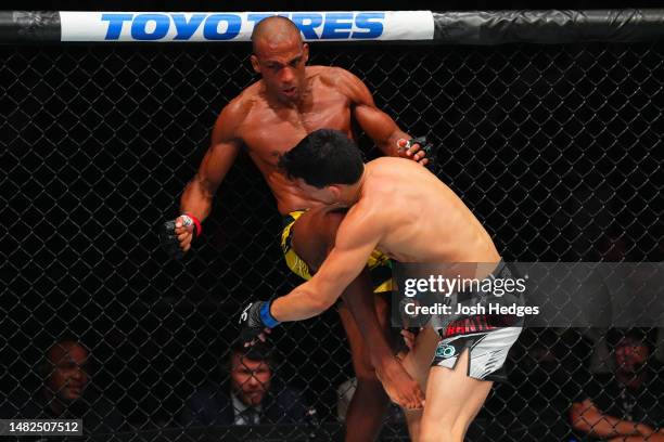 Edson Barboza of Brazil lands a knee to the chin of Billy Quarantillo in a featherweight fight during the UFC Fight Night event at T-Mobile Center on...