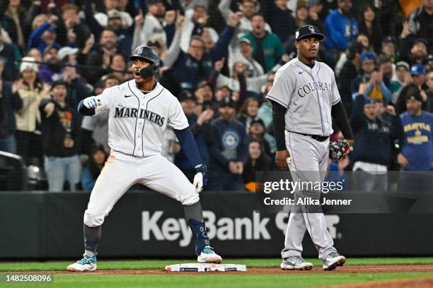 Julio Rodriguez of the Seattle Mariners celebrates after hitting a triple during the fourth inning of the game against the Colorado Rockies at...