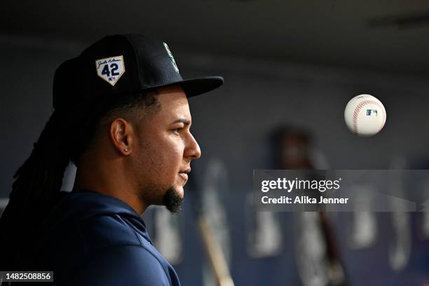 Luis Castillo of the Seattle Mariners tosses the ball in the dugout during the game against the Colorado Rockies at T-Mobile Park on April 15, 2023...