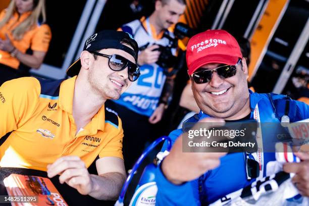 Pato O'Ward signs autographs at the 2023 Acura Grand Prix Of Long Beach on April 14, 2023 in Long Beach, California.