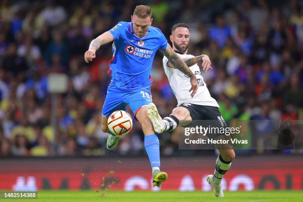 Carlos Rotondi of Cruz Azul battles for possession with Miguel Layun of America during the 15th round match between Cruz Azul and America as part of...