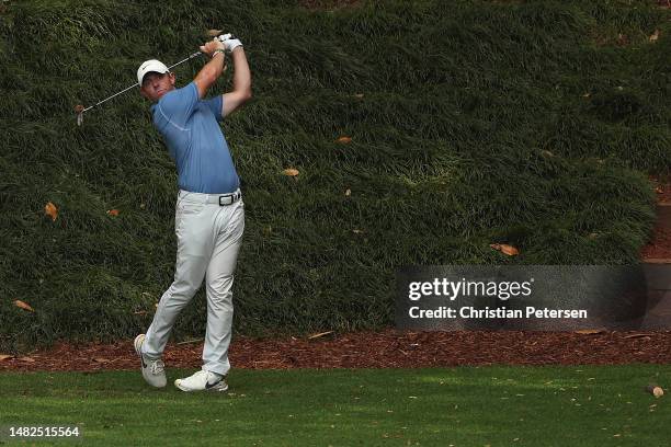 Rory McIlroy of Northern Ireland plays his shot from the ninth tee during the Par 3 contest prior to the 2023 Masters Tournament at Augusta National...